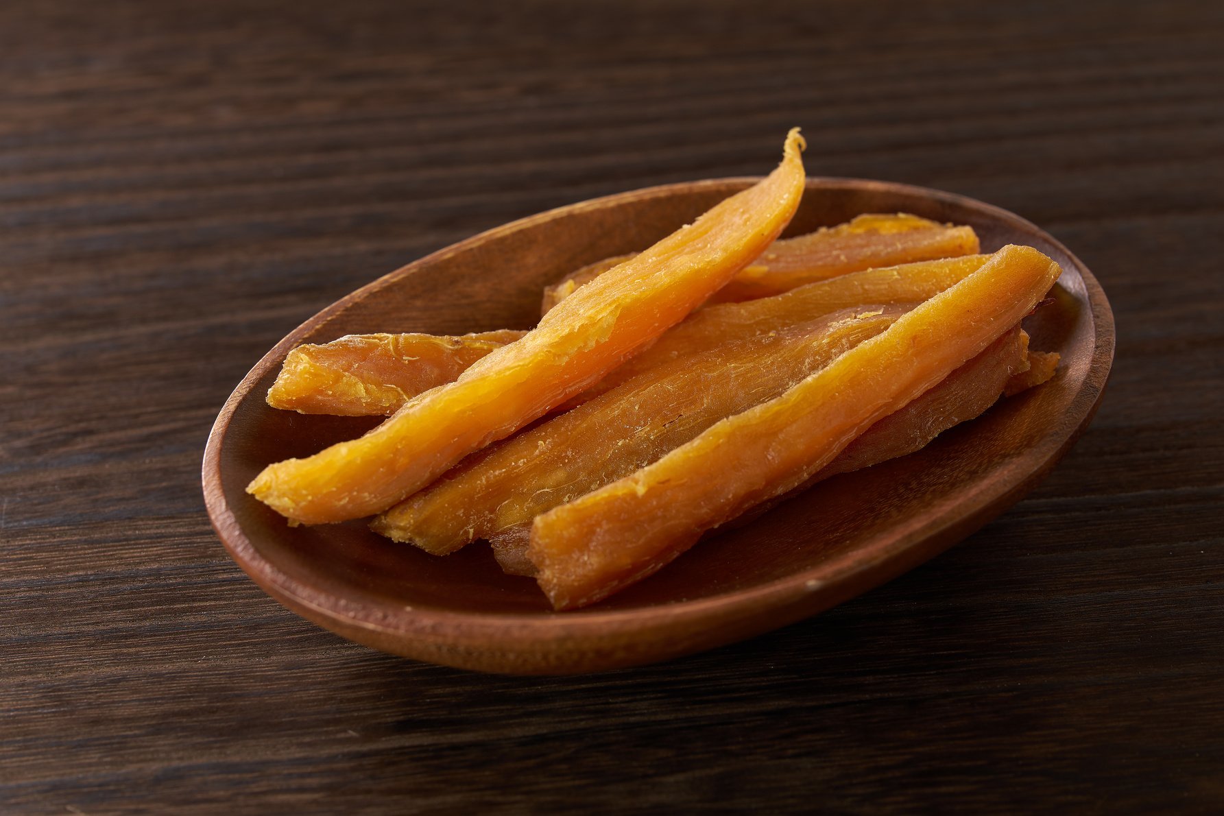 dried sweet potato on wooden table